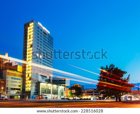 TALLINN, ESTONIA - JULY 26, 2014: Night view of City Plaza good example of modern office architecture that incorporates a few restaurants, a spa and a gym complex as well.