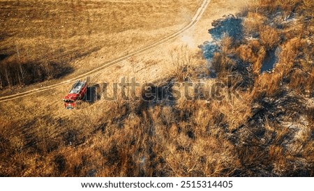 Similar – Image, Stock Photo Aerial View. Spring Dry Grass Burns During Drought Hot Weather. Bush Fire And Smoke In Forest. Wild Open Fire Destroys Grass. Nature In Danger. Ecological Problem Air Pollution. Natural Disaster.