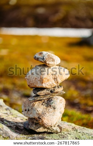 Stack Of Rocks Stones, On Blurred Background, On Norwegian Mountain, Norway Nature.