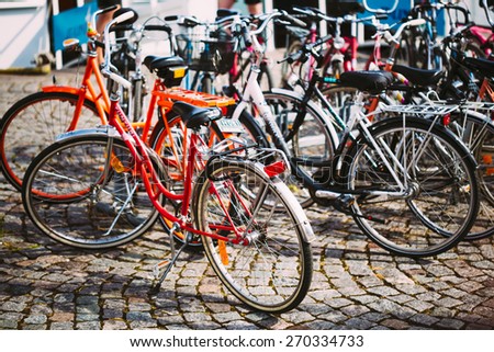 HELSINKI, FINLAND - JULY 27, 2014: Parked Bicycles On Sidewalk. Bike Bicycle Parking In City.