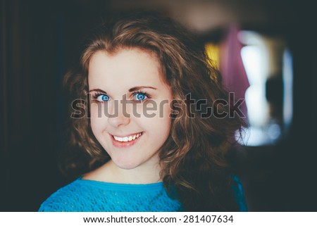 Portrait Of Beautiful Plus Size Young Woman In Blue Blouse Opening Door In Home, Looking Very Happy