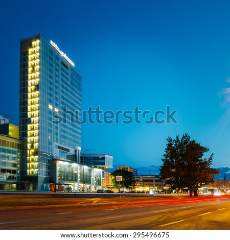 TALLINN, ESTONIA - JULY 26, 2014: Night view of City Plaza a good example of modern office architecture that incorporates a few restaurants, a spa and a gym complex as well.