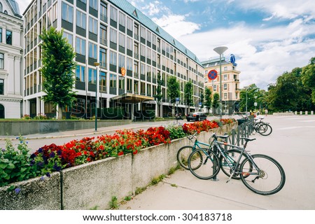 OSLO, NORWAY - JULY 31, 2014: Parked Bicycle On Sidewalk near The Ministry of Foreign Affairs of Norway