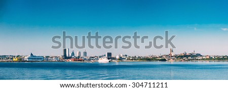 Panoramic Skyline Of Tallinn And Harbour, Coast With Blue Clear Sky At Sunrise, Estonia. View From Sea, Gulf Of Finland