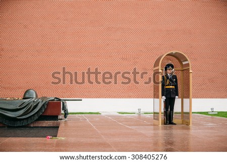 Moscow, Russia - May 24, 2015: Post honor guard at the Eternal Flame in Moscow at the Tomb of the Unknown Soldier (Post number 1) in the Alexander Garden in Moscow close by Kremlin walls