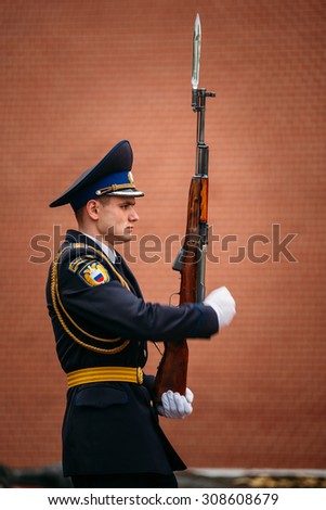 Moscow, Russia - May 24, 2015: Post honor guard at the Eternal Flame in Moscow at the Tomb of the Unknown Soldier (Post number 1) in the Alexander Garden in Moscow close by Kremlin walls