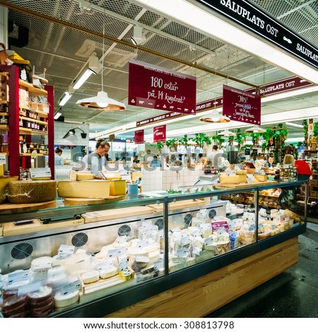 STOCKHOLM, SWEDEN - JULY 30, 2014: Trade in traditional Swedish food - Cheeses in the local Hay Market Hotorget.