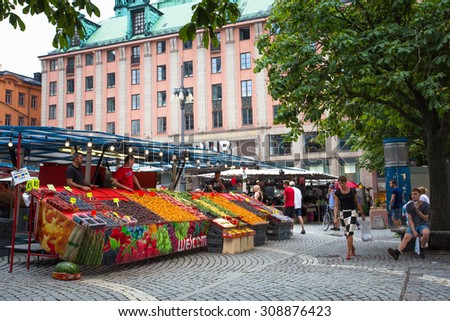 STOCKHOLM, SWEDEN - JULY 30, 2014: Trade fruits and vegetables food in local Hay Market Hotorget.