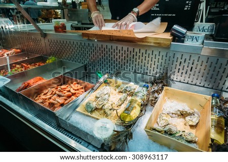 STOCKHOLM, SWEDEN - JULY 30, 2014: Trade in traditional Swedish food seafood in the local Hay Market Hotorget.