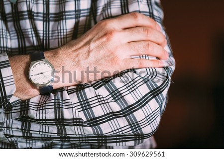Close Up Vintage Old Watch On Man Hand. Men Wear In Striped Shirt