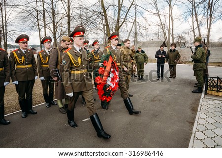 Pribor, Belarus - April 4, 2015: Cadets Ministry of Emergency Situations laying of wreaths at mass grave of Soviet soldiers who died during battles for liberation of Belarus in World War II.