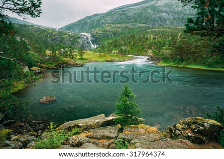 Giant Tall Waterfall in the Valley of waterfalls in Norway. Husedalen Waterfalls were a series of four giant waterfalls in the South Fjord.