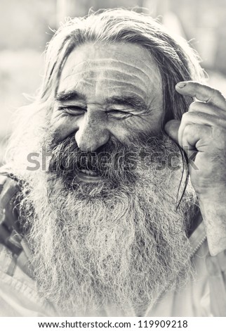portrait of  laughing old man with gray beard