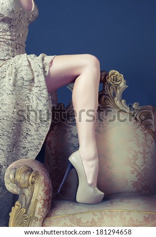 Beautiful slim leg on the luxury vintage armchair