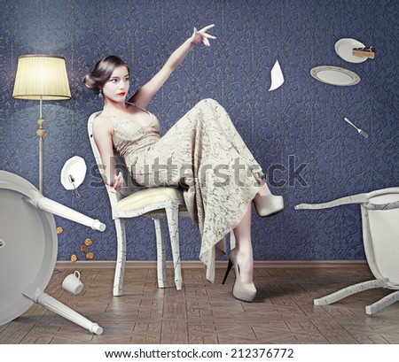 Angry beautiful woman drops the table during dinner