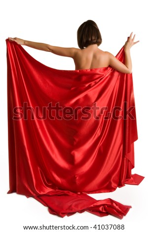 Beautiful young woman posing nude with red satin sheet