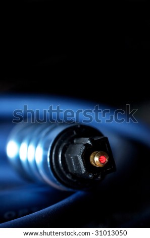 laser fiber optic link cable plug close up focus on it\'s tip