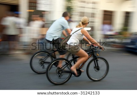 sight seeing bikers riding on the street motion blur