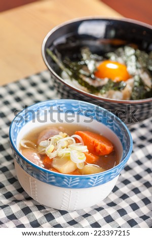 Japanese style pork stewed with rice and preserved egg yolk