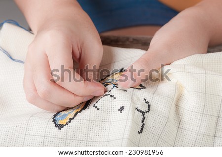 Cross-stitch, a housewife hobby in spare time.