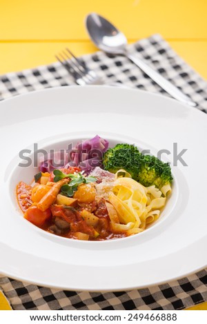 Pasta with red sauce, pasta made from sweet potato, clean food.