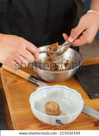 A chef making food for customer in kitchen