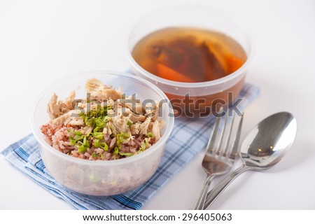 Brown rice gruel with chicken breast with vegetables soup cooked by clean food concept in separate lunch box