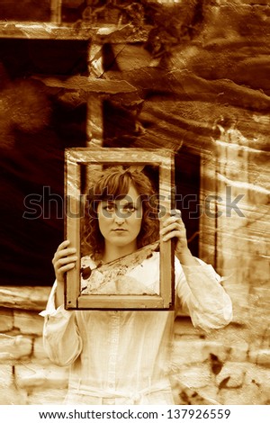 retro sepia photo European girl woman in white dress holding window frame with broken glass on background of ruins of fall autumn