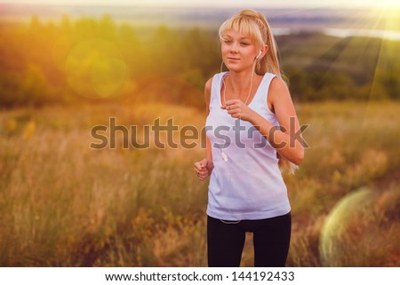 sunlight fitness blonde sport girl woman running runner nature lifestyle female exercise healthy young run