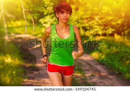 sunlight beautiful a healthy runs brunette young woman athlete running outdoors, fitness and healthy lifestyle, running