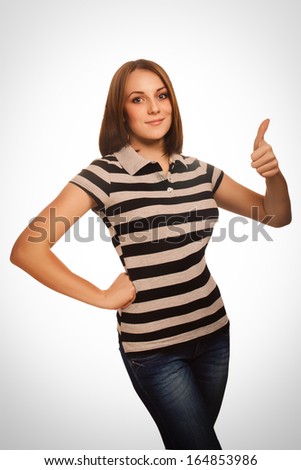 woman girl shows positive sign thumbs yes isolated in striped T-shirt emotion
