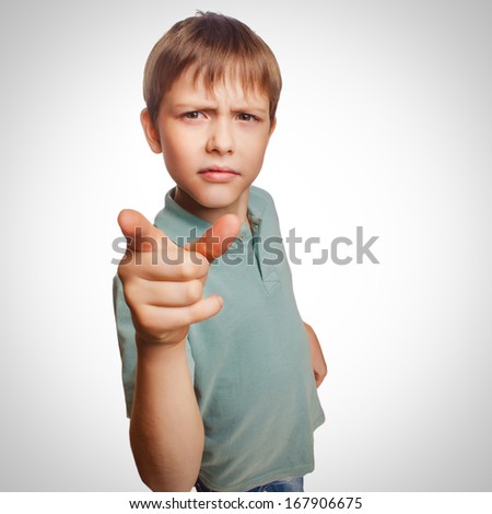 Angry boy shows his finger to screen evil is isolated on white background emotion gray