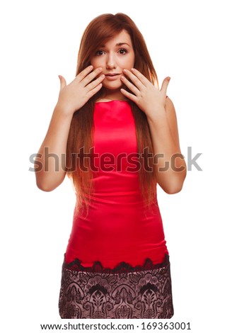 Surprised excited brunette woman throws up his hands opened her mouth isolated in red dress