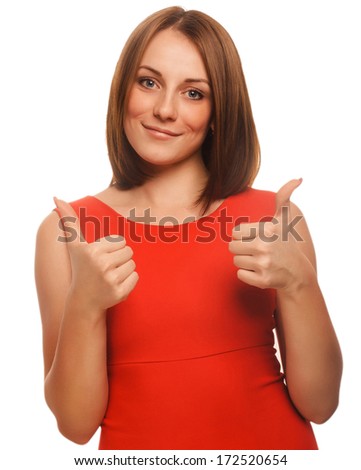 happy young woman girl shows positive sign thumbs yes, orange dress isolated large