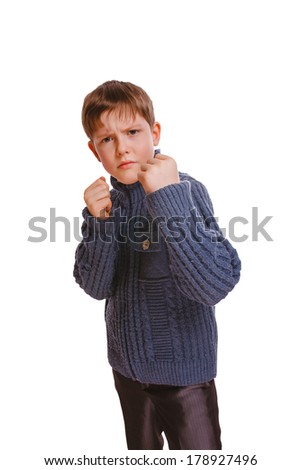 angry teenager boy clenched his fists fight isolated on white background