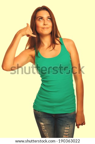 girl woman shows gesture phone call isolated on white background cross processing retro
