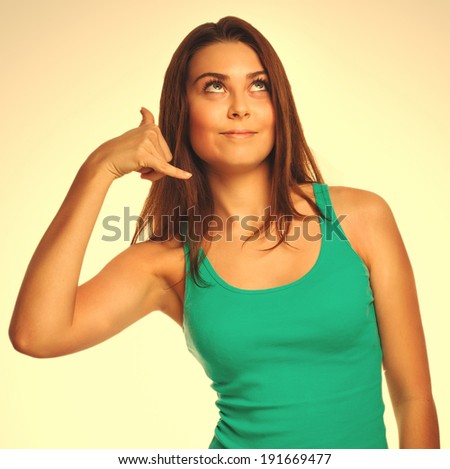 girl woman shows gesture phone call isolated on white background gray large cross processing retro