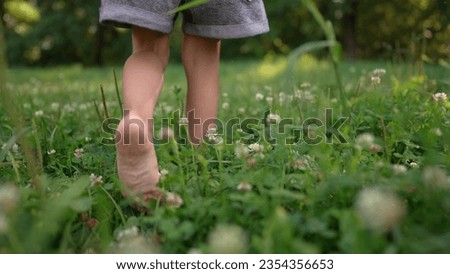 Similar – Image, Stock Photo Little girls walking barefoot on the sand and caring a picnic basket together. Summer leisure, love and friendship.