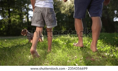 Similar – Image, Stock Photo Little girls walking barefoot on the sand and caring a picnic basket together. Summer leisure, love and friendship.