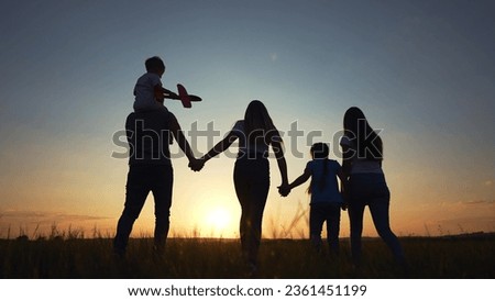 Similar – Image, Stock Photo Three children with three wheels sitting on the ground in front of a house in South America