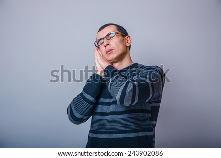 European-looking man of 30 years  in glasses  wants to sleep