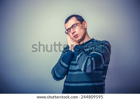 European-looking man of 30 years in glasses wants to sleep cross process