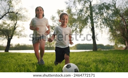 Similar – Image, Stock Photo Two children playing with their mobile on the beach