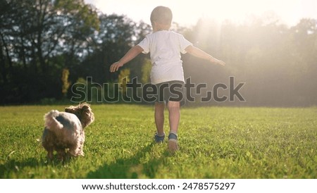 Similar – Child and dog in water