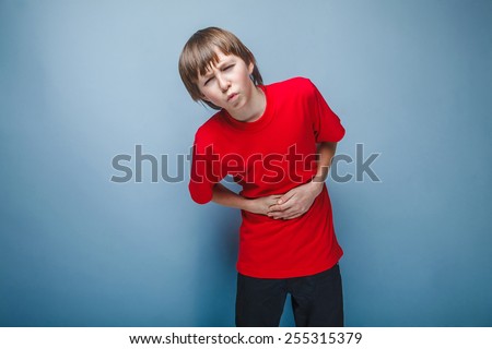 Boy teenager twelve years in the red shirt abdominal pain, gastritis, diarrhea