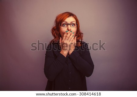 European - looking  woman 30 years  his hands over his mouth retro