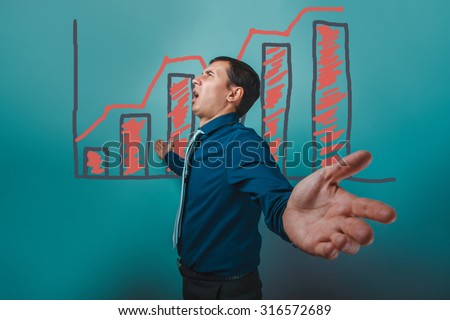 man businessman arms outstretched to the sides cries stands sideways chart growth business strategy infographics studio blue background