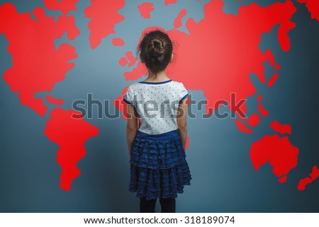 Teenage girl is looking back on the world map infographics studio background