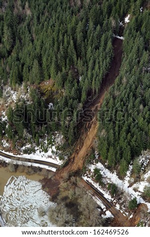 Mudslides scar the hillsides of Washington state following heavy rain on top of snow.