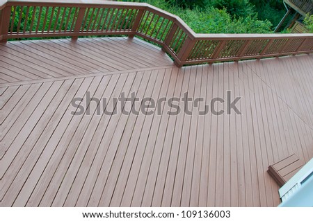 A beautiful wood deck after application of fresh paint and stain.